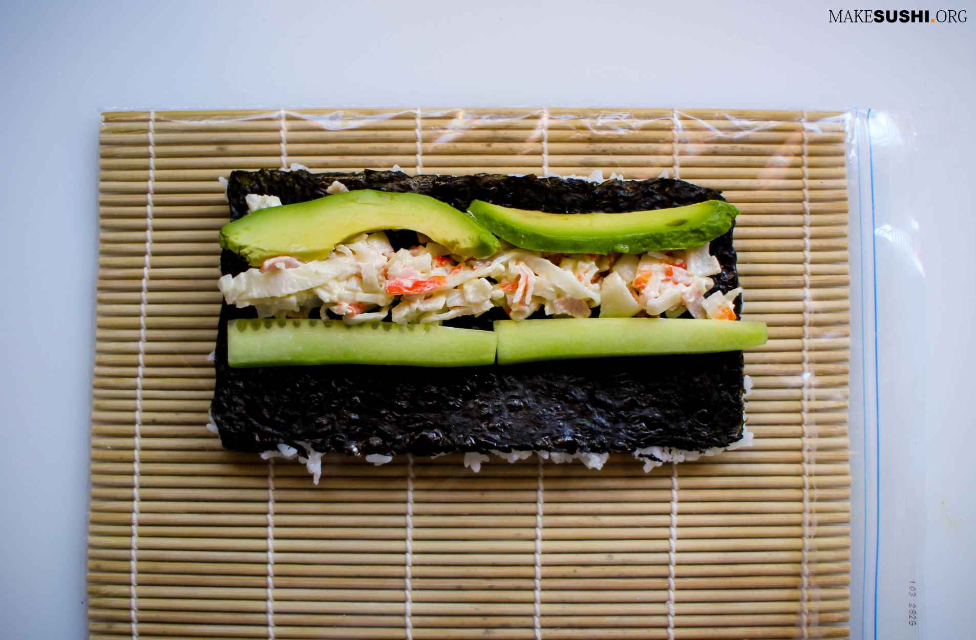 california-roll-layed-out-on-sushi-rolling-mat